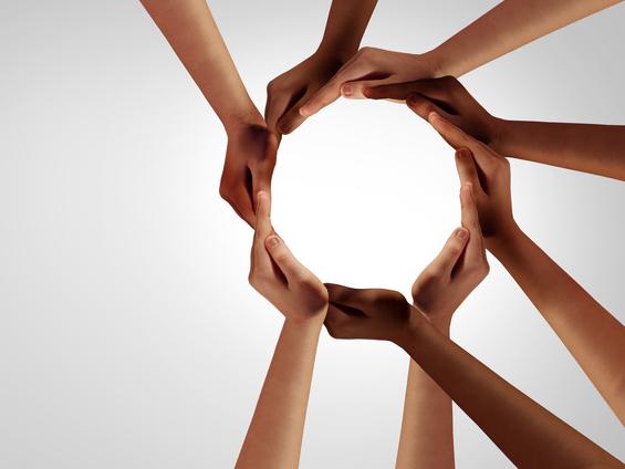 Hands locked in a circle illustrating race equality curriculum