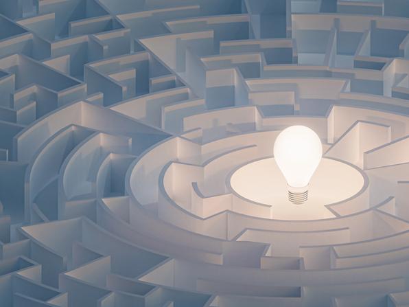 lightbulb in maze illustrating adoption of ed-tech in universities