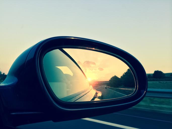 Sunset in a car rearview mirror