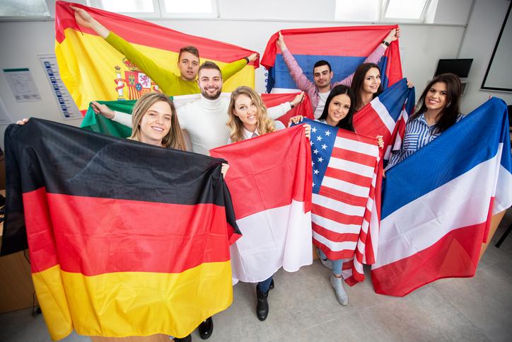 International students showing off their national flags