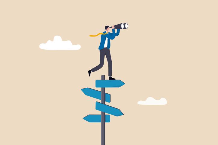 An illustration of a man balancing on top of a sign, using binoculars to look far in the distance