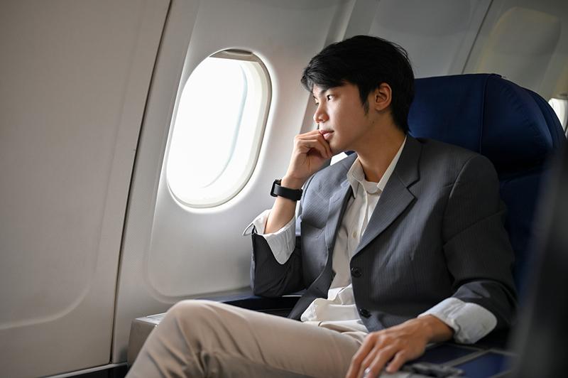 Asian man on plane