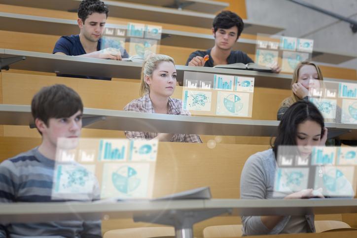 Students in a lecture hall use futuristic learning technology