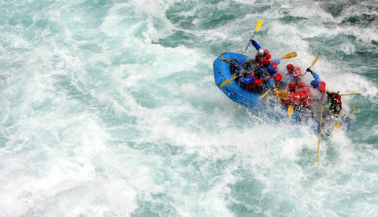 A team of white water rafters battle the rapids