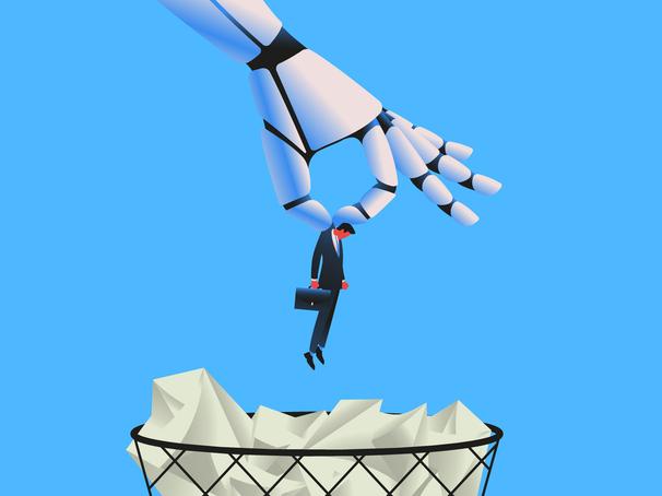 A robot hand dangles a businessman above a wastepaper bin