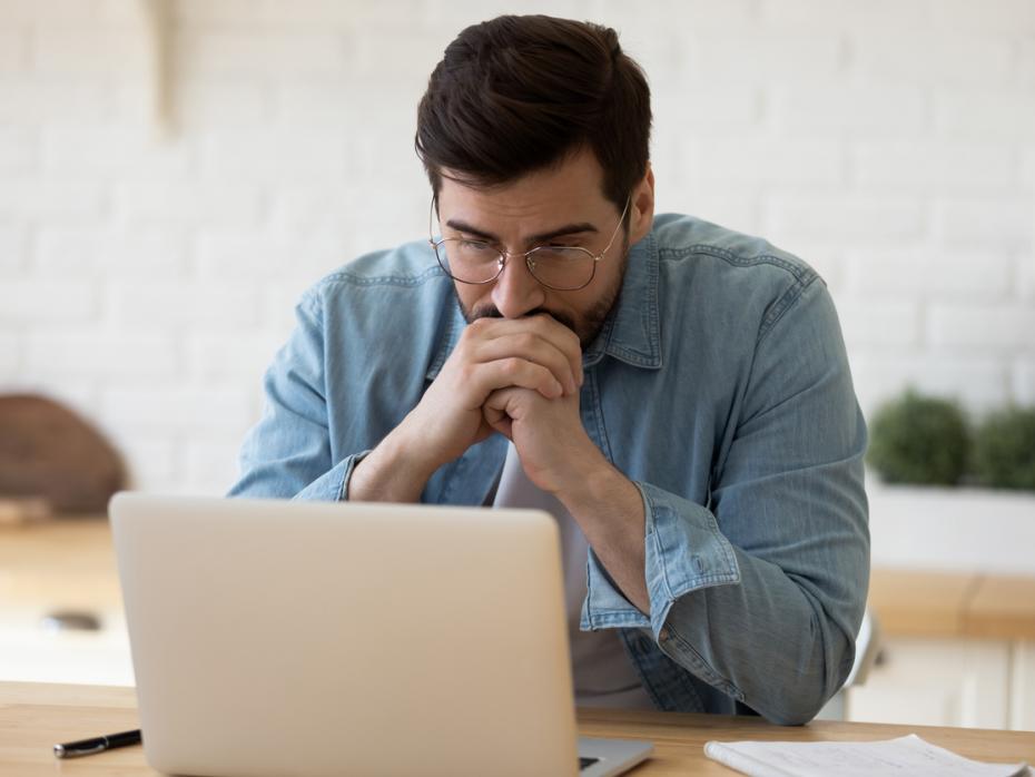 A student studying at a laptop