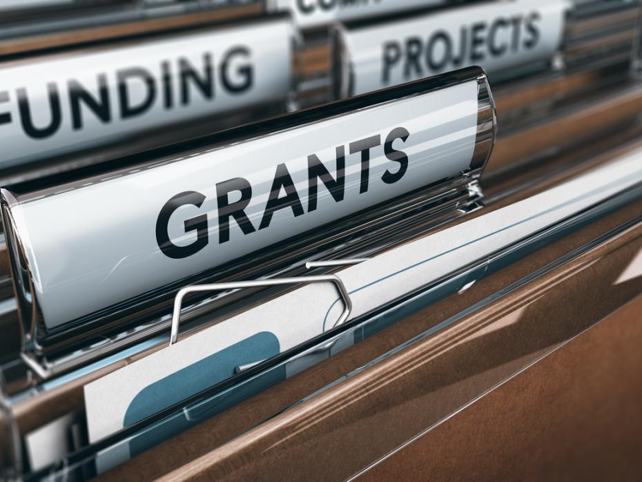 Filing cabinet with files labelled "funding" and "grants"