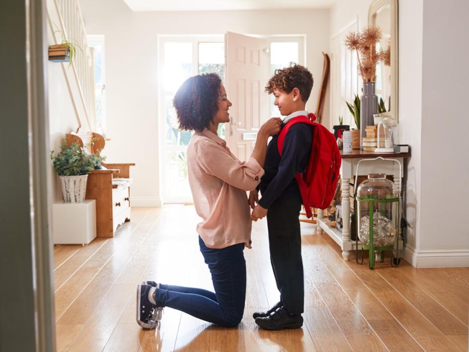 Mother getting her son ready for school