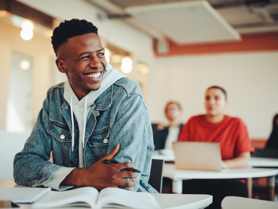 A student smiling in class