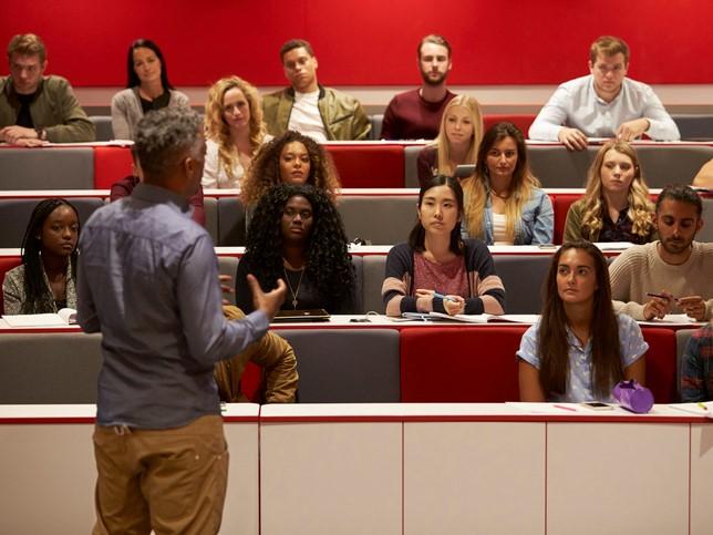 A lecturer speaks to university students, but what is the role of the lecture in modern HE?