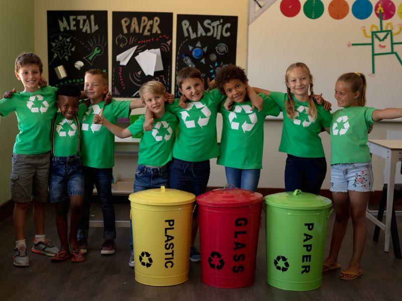 A group of school children learning about recycling