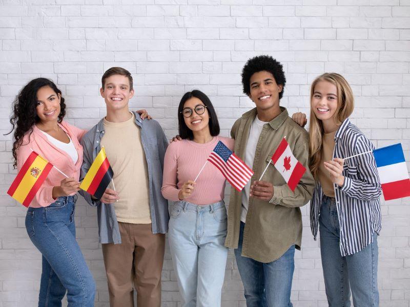 Group of international students’ showing their national flags