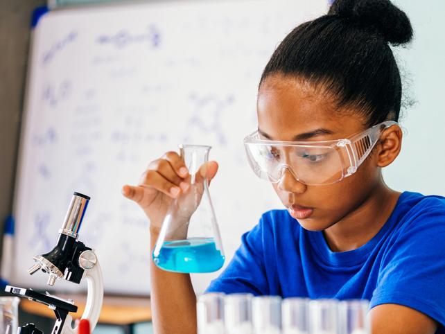 Young girl doing chemistry experiment