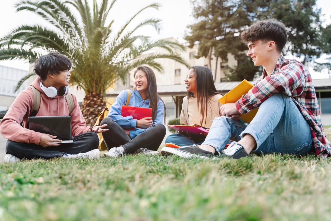 A group of international students chatting together on campus