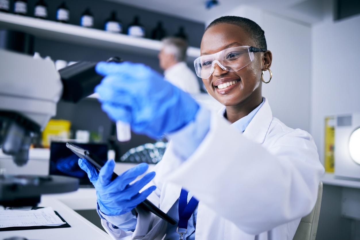 A young female researcher working in the lab