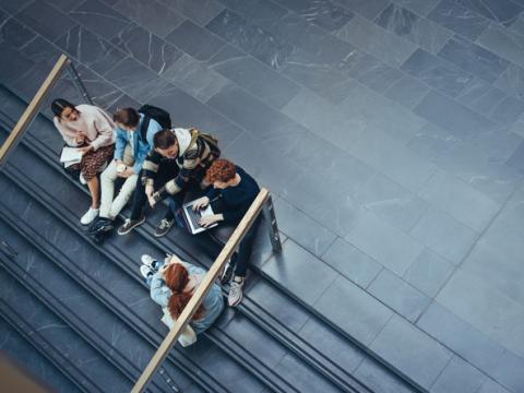 Aerial view of students sitting on steps