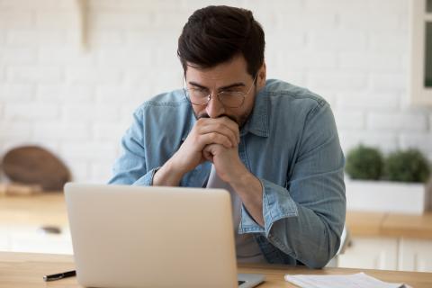 A student studying at a laptop