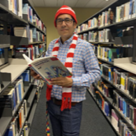 Hector Viveros Tapia in the university library for the Where's Hector? scavenger hunt