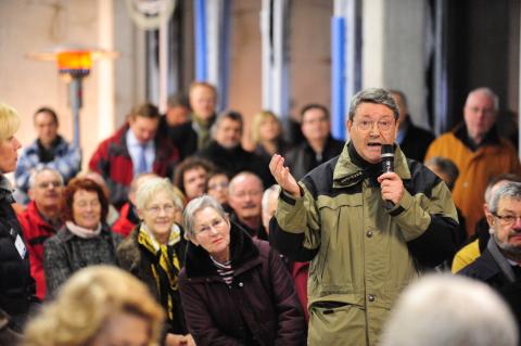 Man speaking at a community meeting