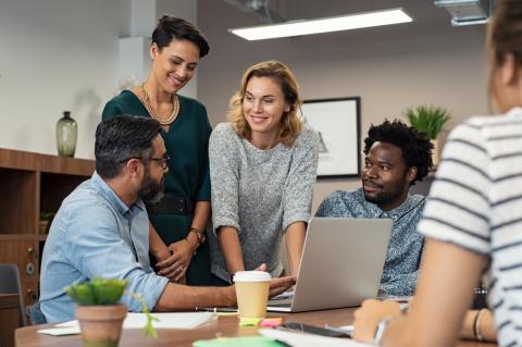 A multiculutral group of staff having a group discussion