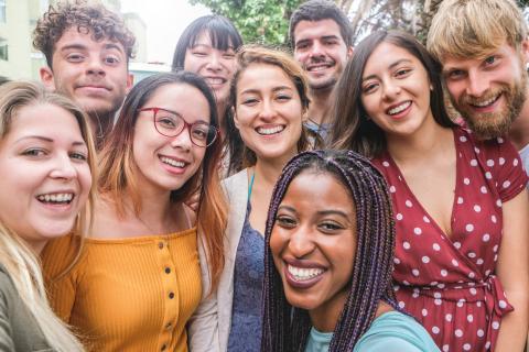 A group of multicultural students smiling to camera