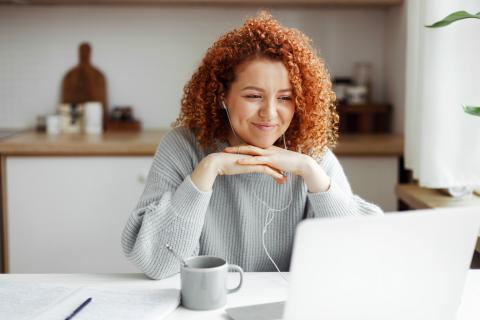 A woman studying at her laptop