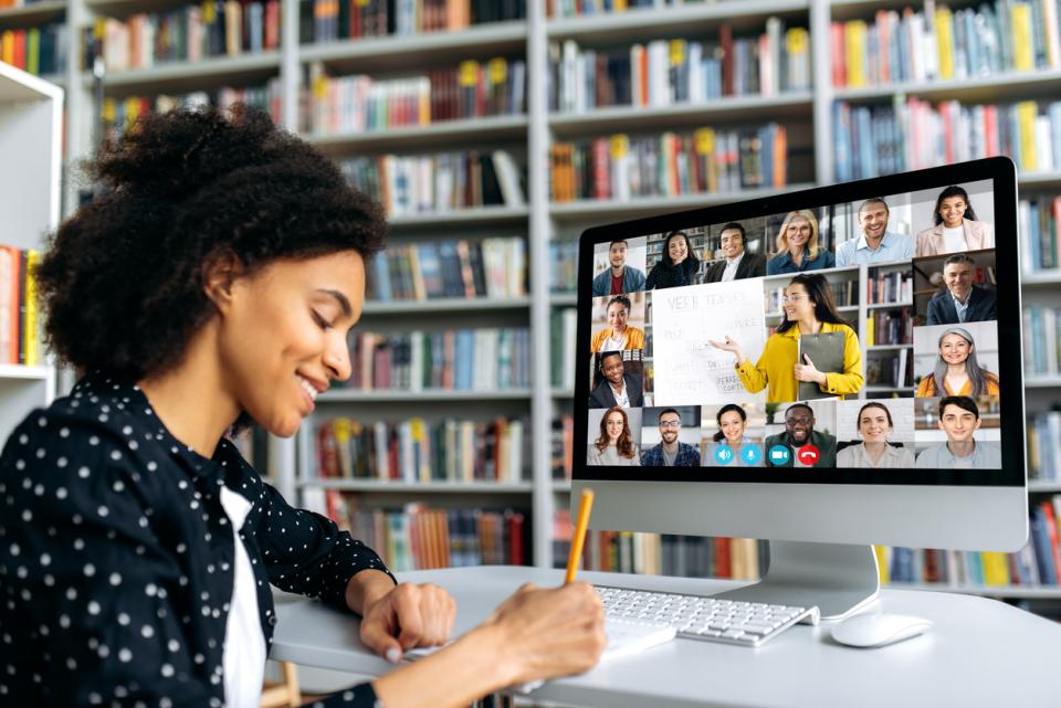 Woman taking part in an online class in a library