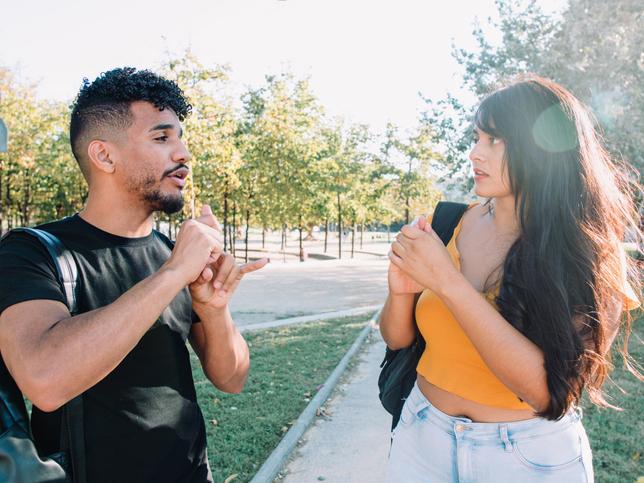 Deaf students signing in conversation