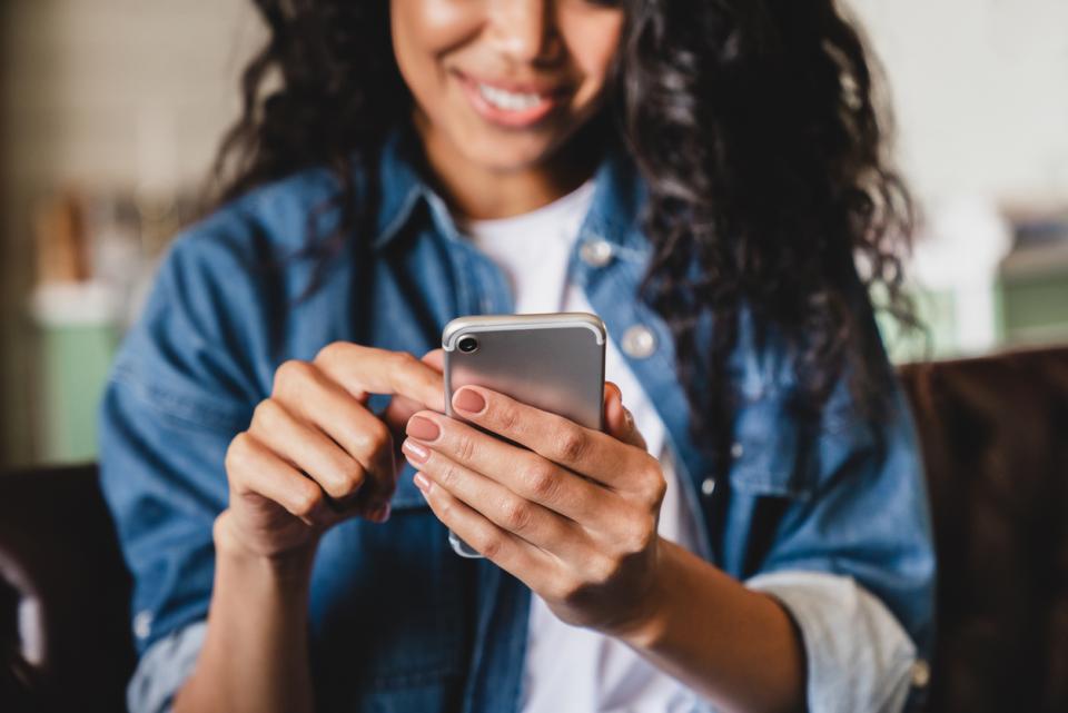 Student using social media on her phone