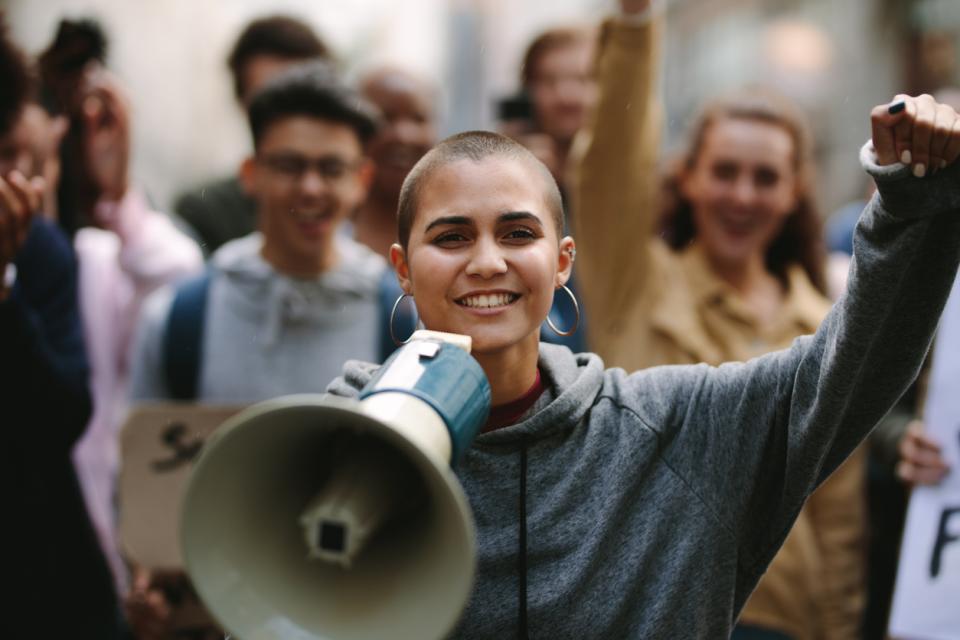 Student with a megaphone on a march