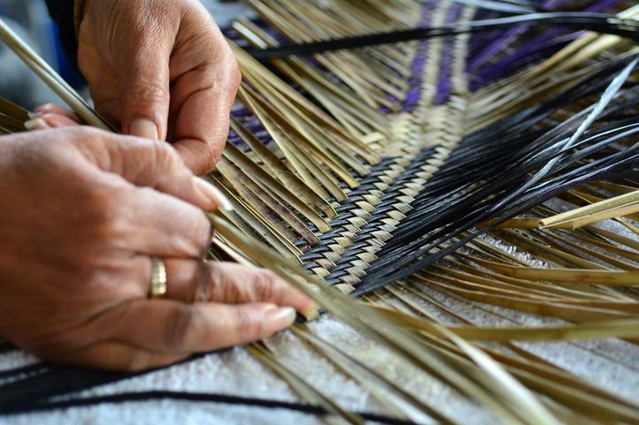 Maori woman weaving