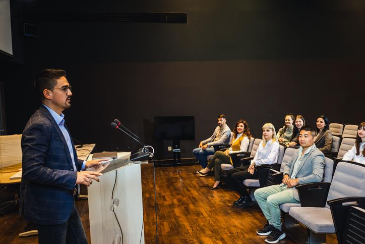 A lecturer gives a talk