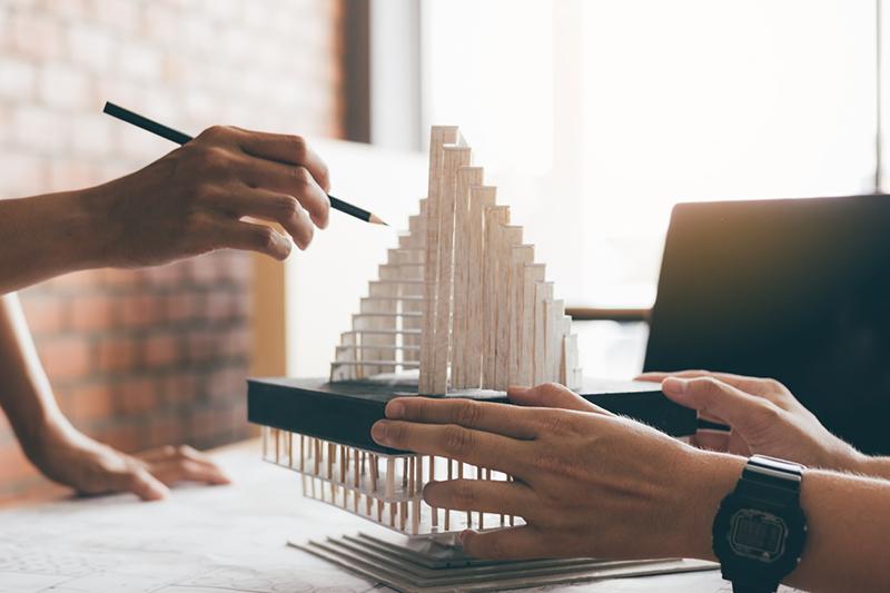 Architects working on a model