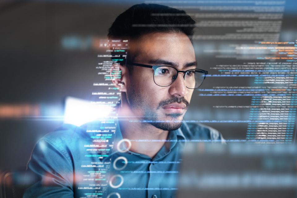 A student in front of a screen coding