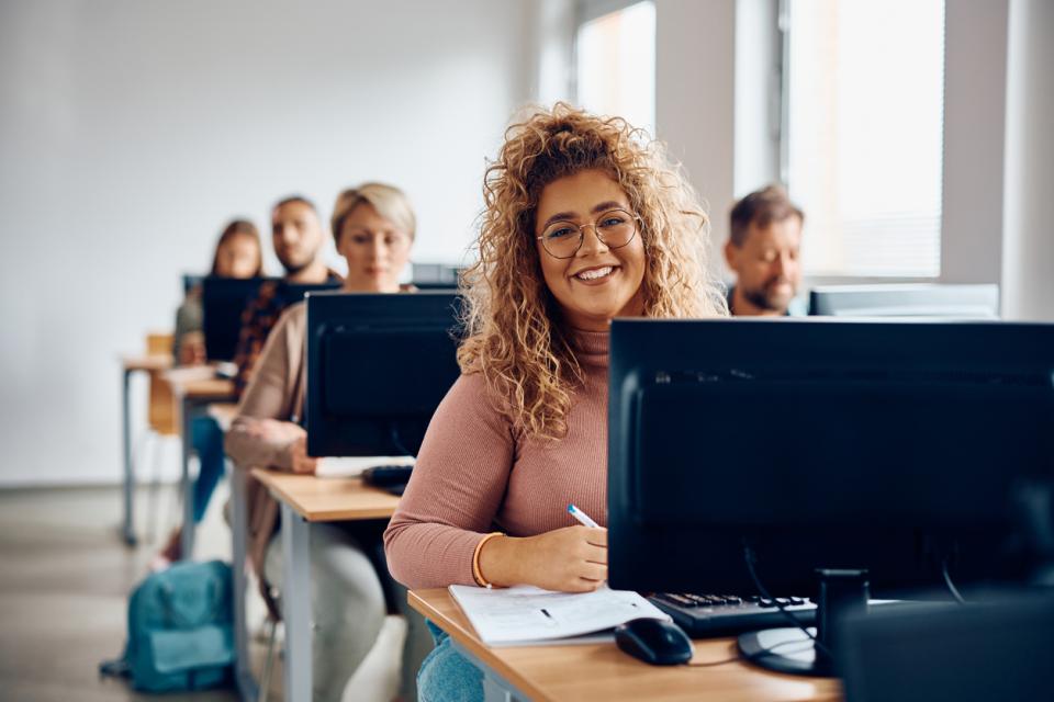 Student sitting at her desk in front of a computer