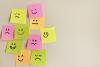 Post-it notes showing smiling and frowning faces